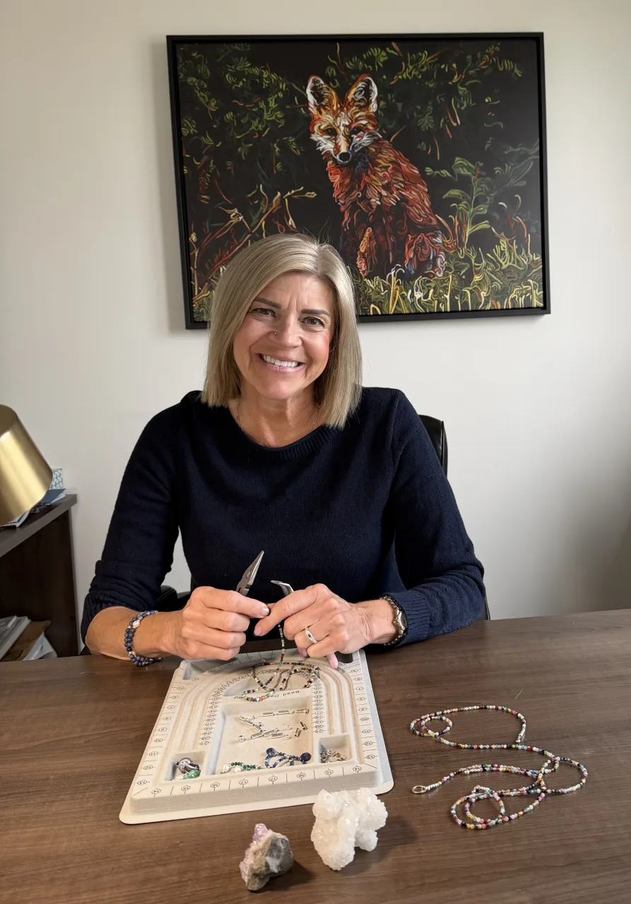 Fran, the maker behind Willow & Fox, handcrafting jewelry at her workbench in Alberta, Canada